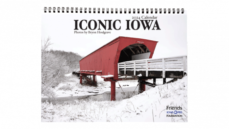 cover of Iconic Iowa 2024 calendar featuring a red covered bridge from Madison County