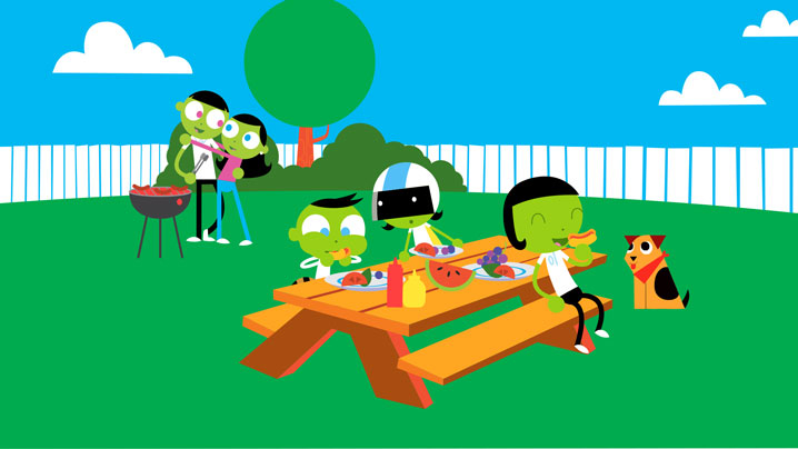 Adults and children have a backyard picnic.