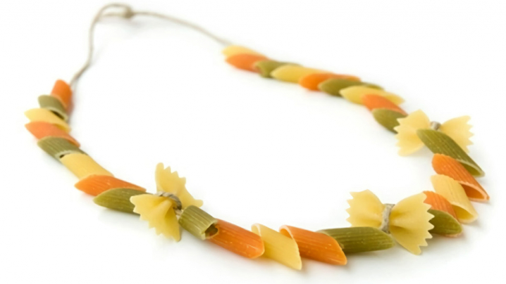 A necklace made out of pasta and stringed in an A B C pattern.