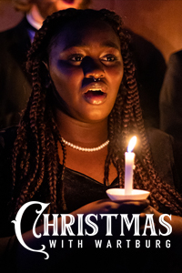 A female student holding a lit candle and singing by candlelight, plus the Christmas With Wartburg logo.