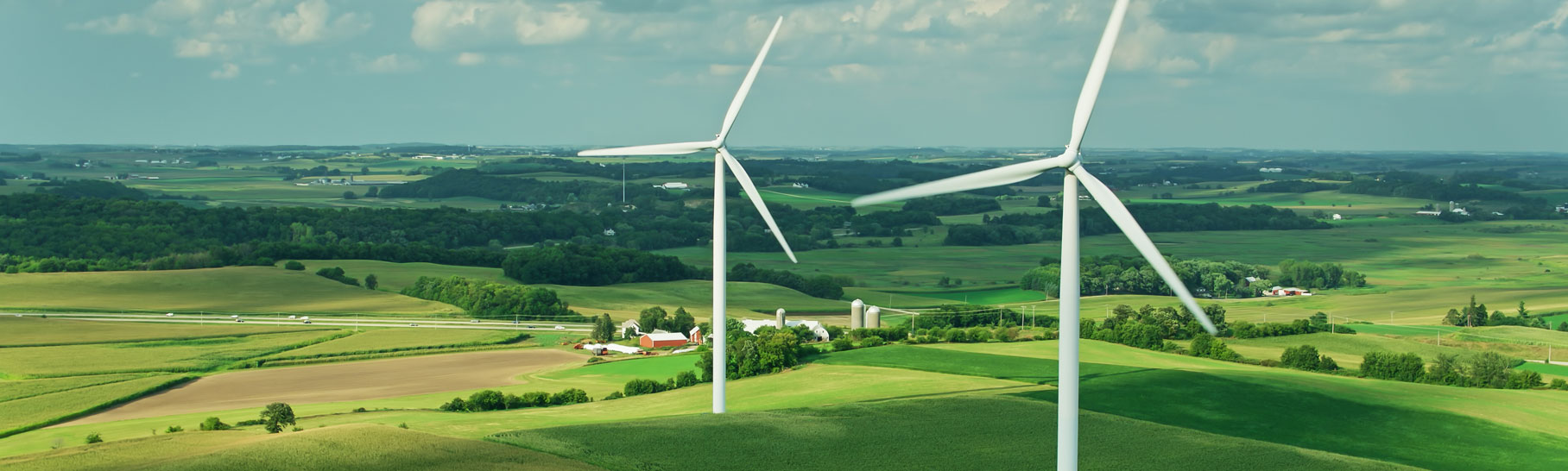 Wind turbines across an agricultural landscape