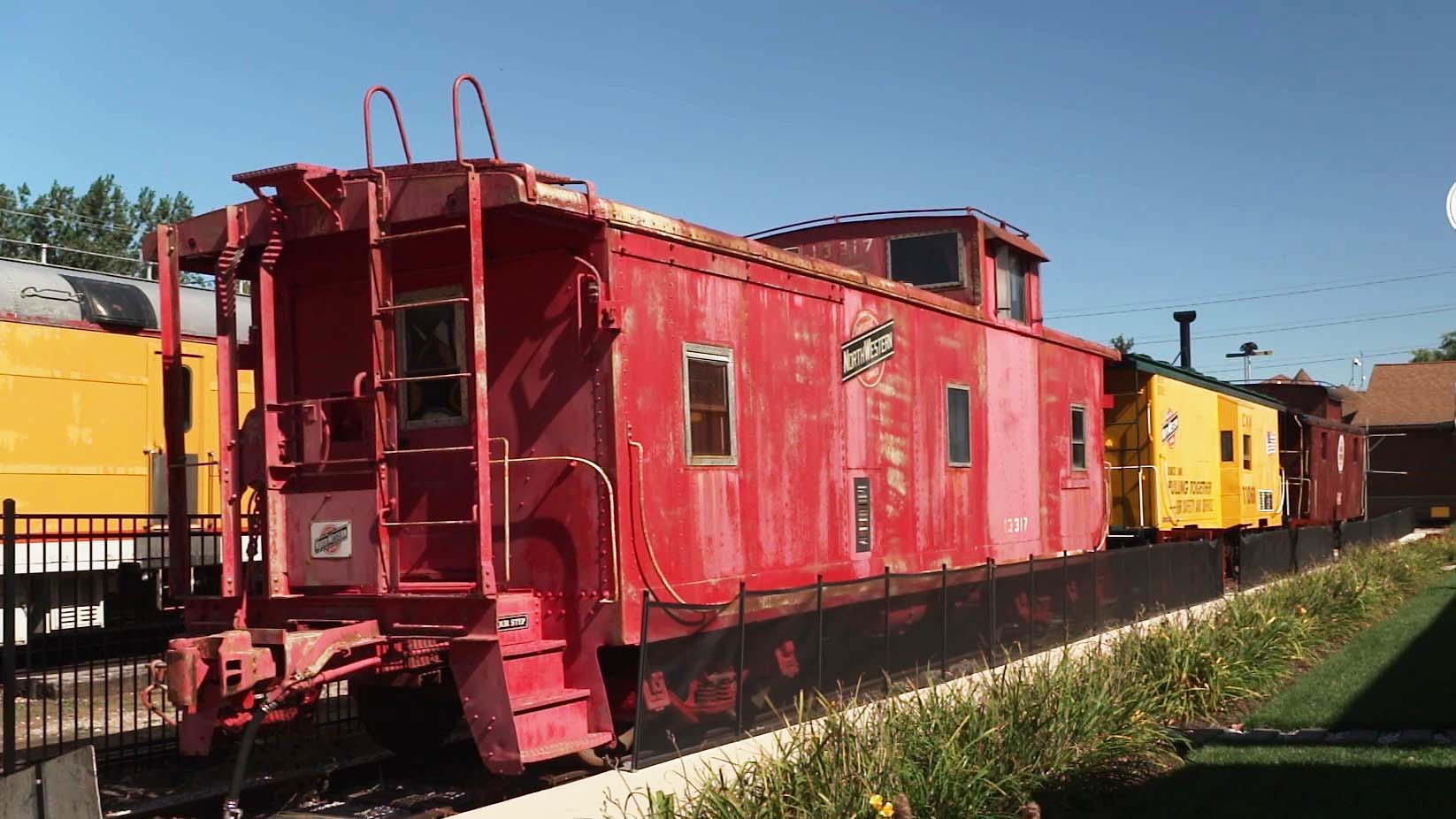 A red caboose of a train.