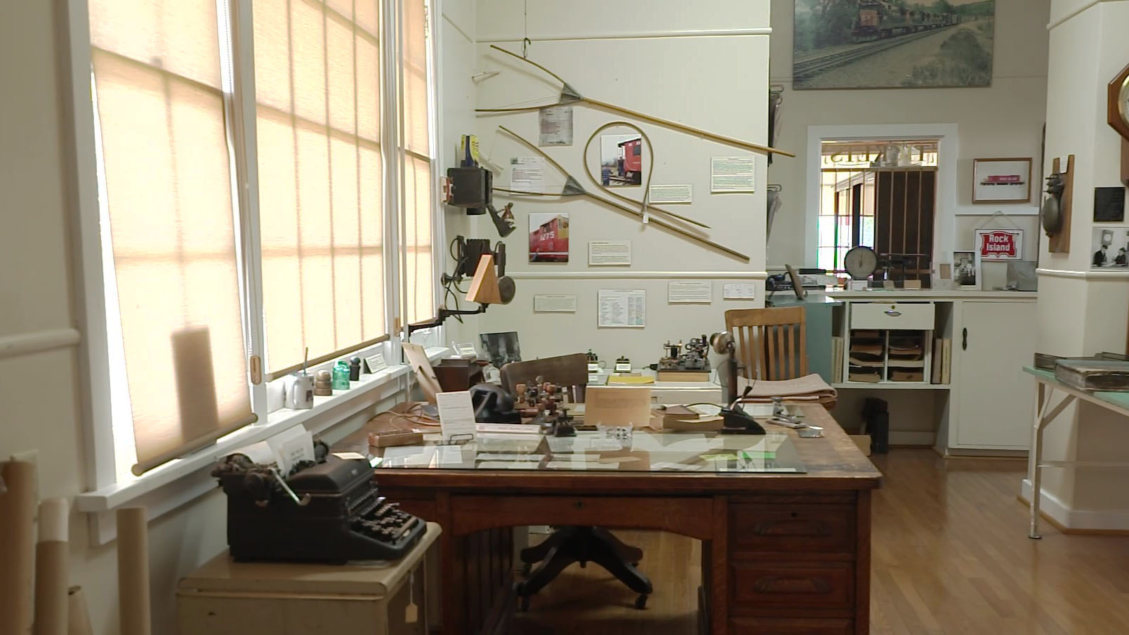 Inside a historic railroad depot showing the station where telegrams were sent and received.