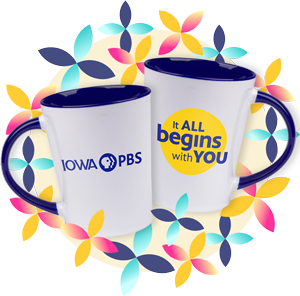 White ceramic mug with a navy blue interior and handle with the Iowa PBS logo on one side and the words It all beings with you on the other side