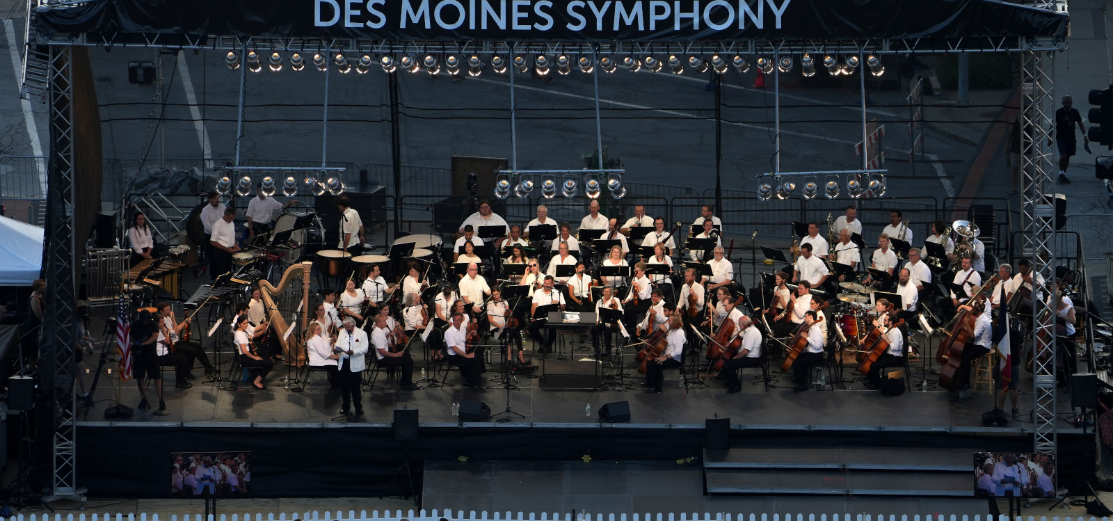 Members of the Des Moines Symphony on stage waiting to perform