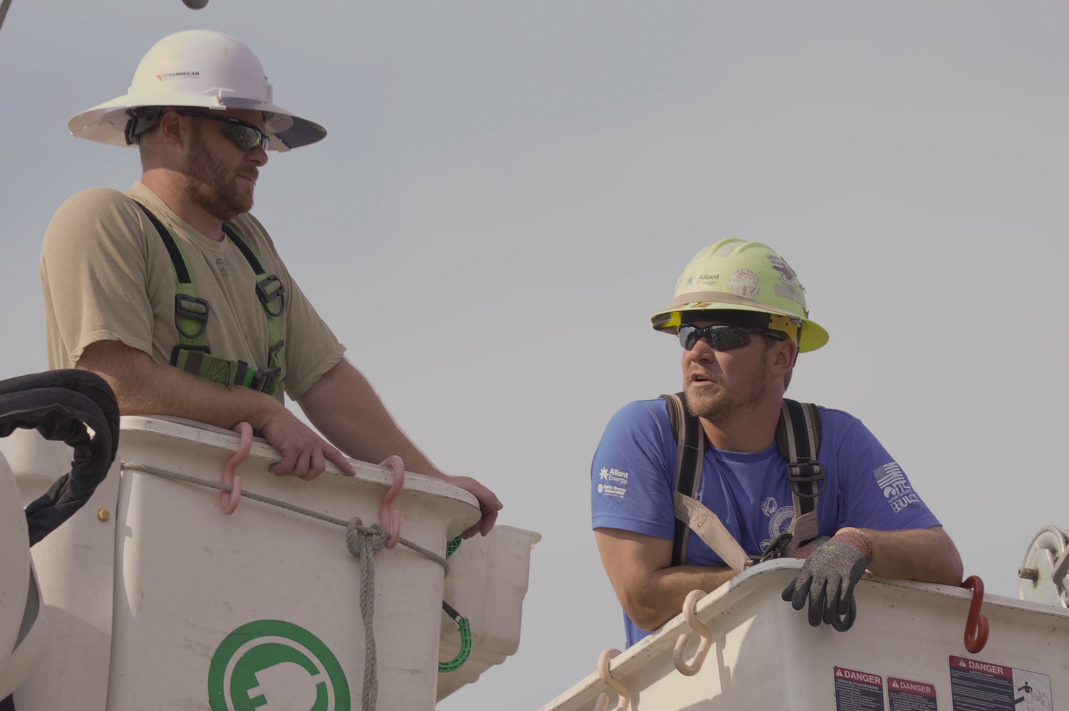 Lineman's Rodeo participants in buckets at the event