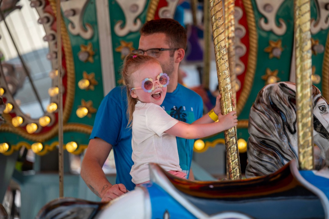 little girl on carousel