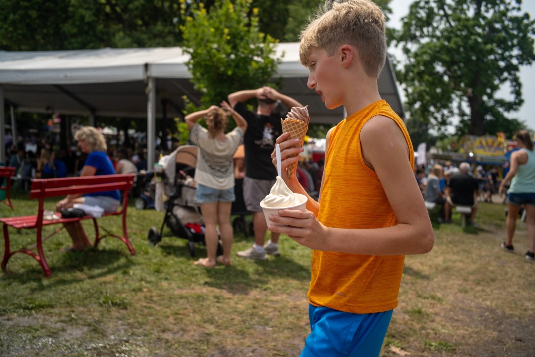 Boy with two ice creams in hand