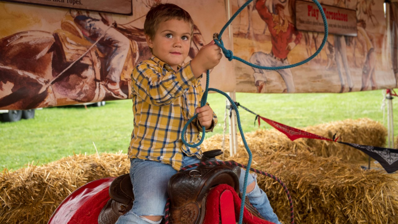 little boy at cowboy boot camp