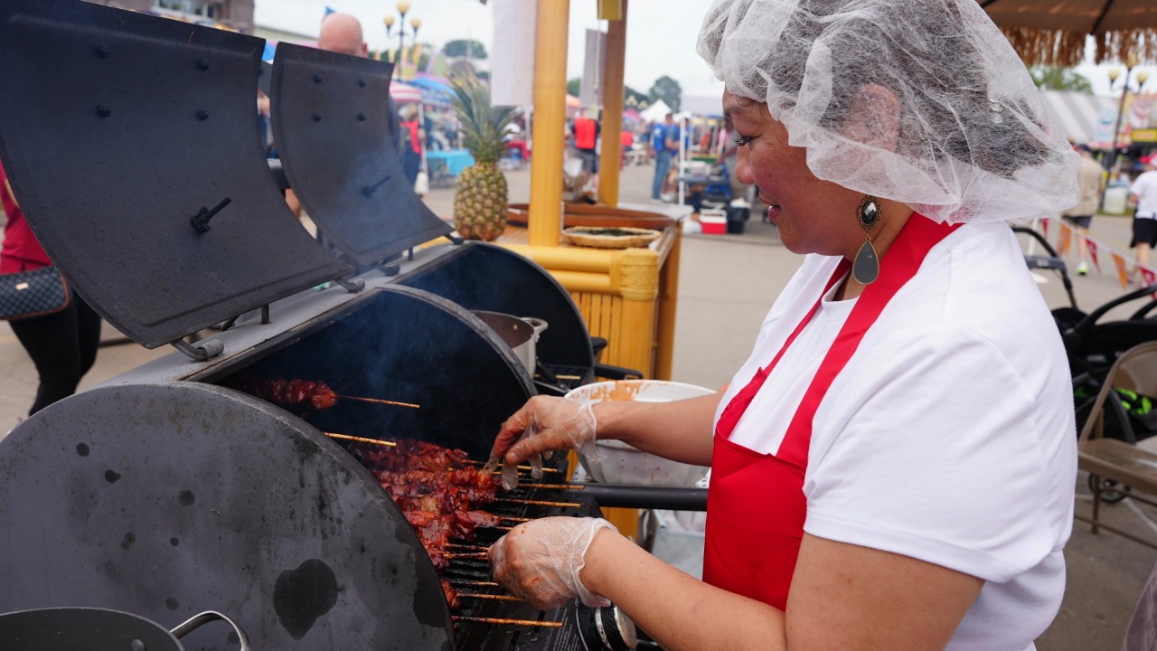 Cookout Contest participant preparing her meat