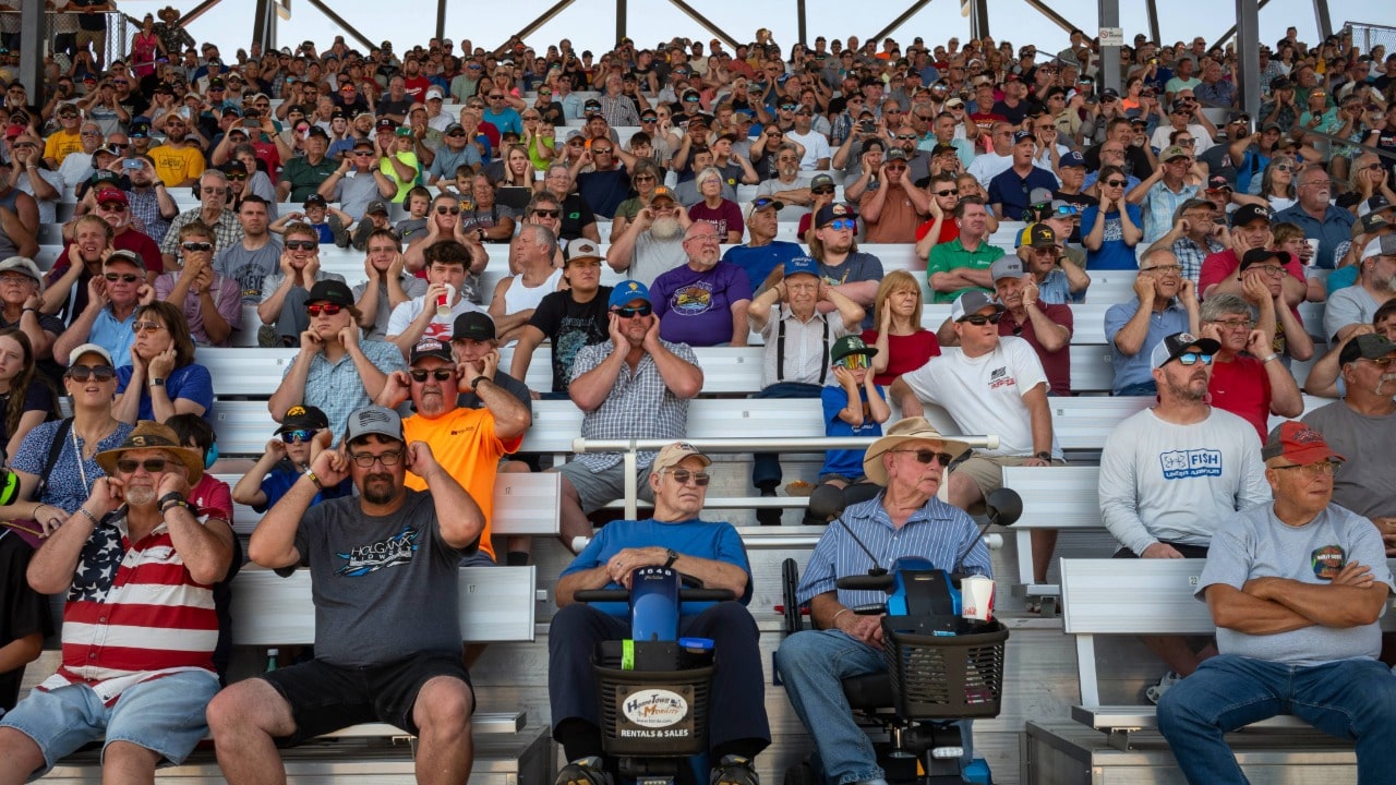 Crowd covering their ears at the Outlaw Truck & Tractor Pull