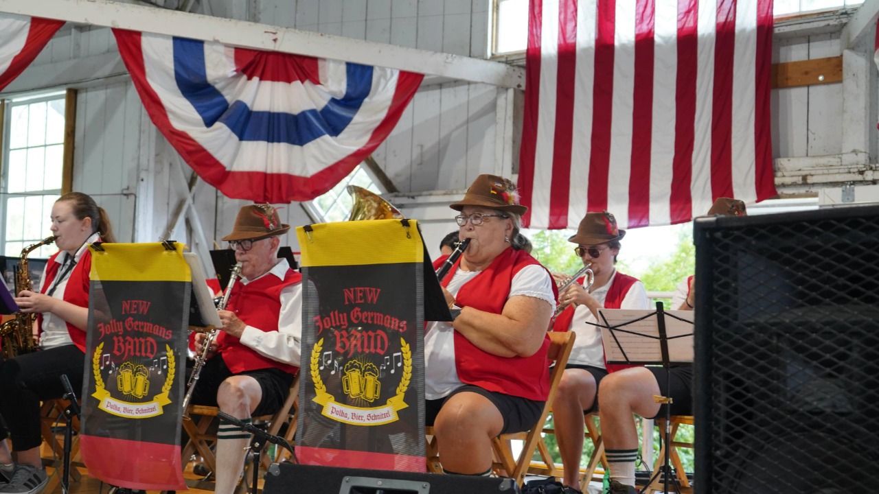Polka Club of Iowa performing on stage at Pioneer Hall