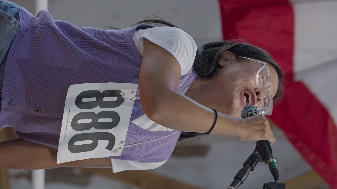 Woman performing at the husband calling contest