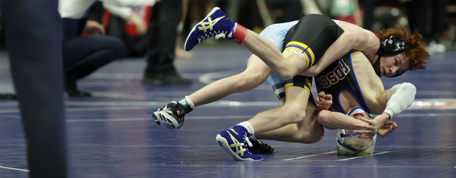 Two high school boys wrestling