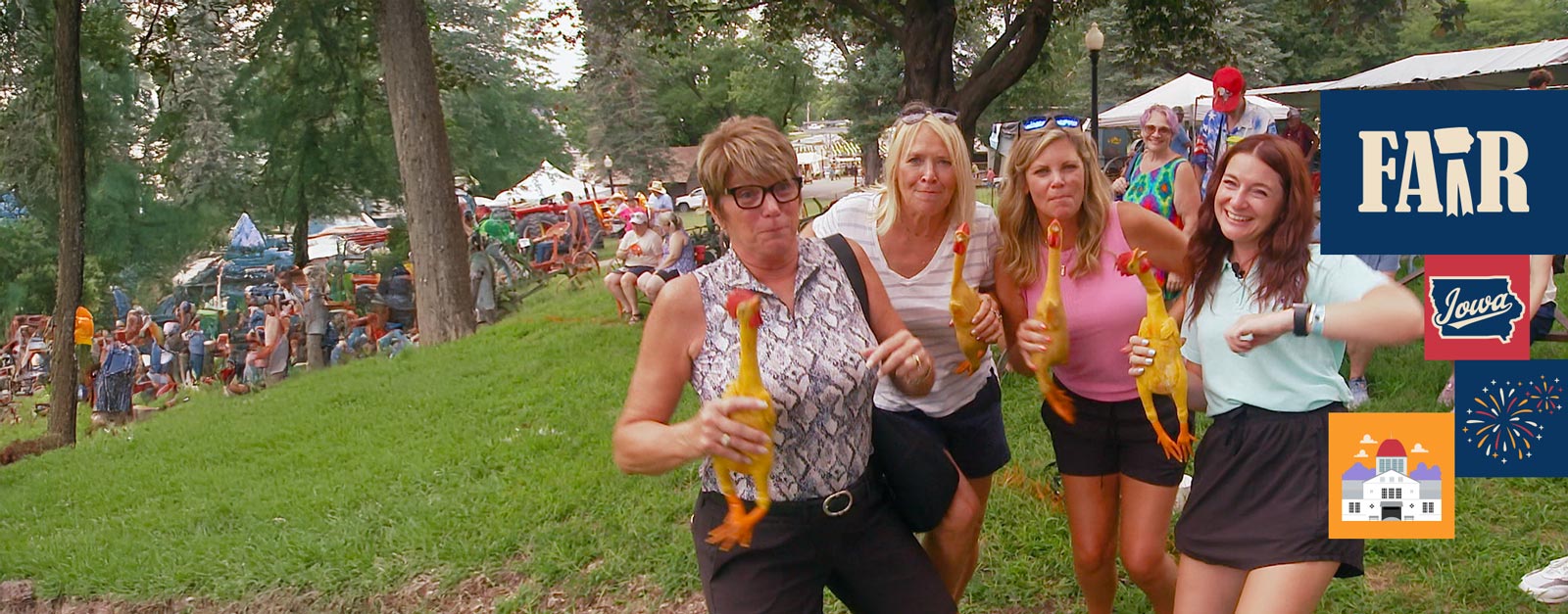 Four women pose with rubber chickens.