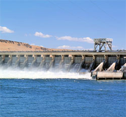 Image of water pouring through a dam.