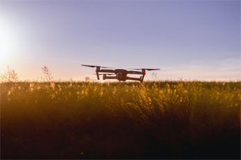 Image of a drone over a field.