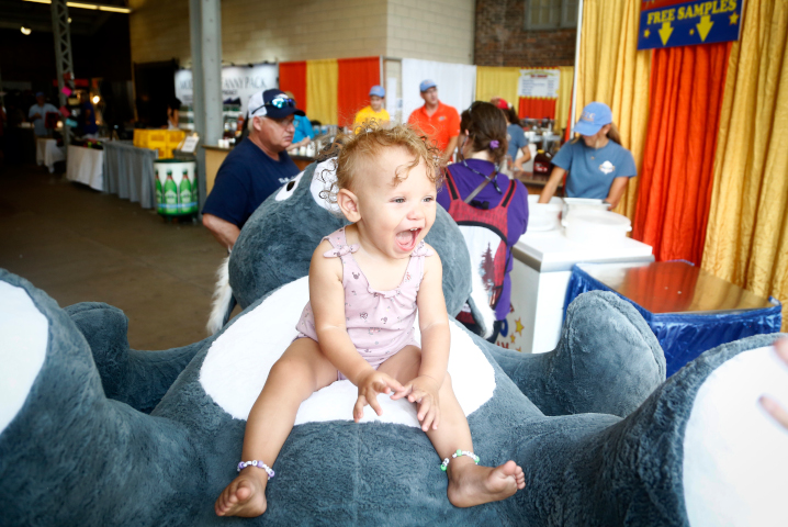 All smiles at the Iowa State Fair when there's a large stuffed animal involved.