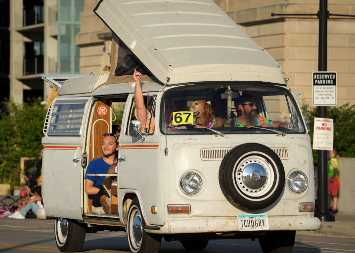 Van with people and a cool dog in the Iowa State Fair parade