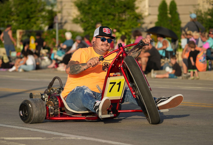 Man on low bike in the Iowa State Fair parade