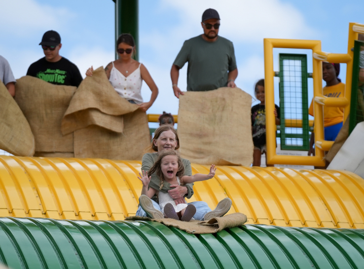 mom and daughter on the big slide at the Iowa State Fair