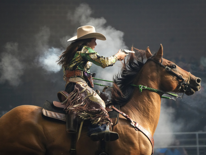 horse with a rider during cowboy mounted shooting