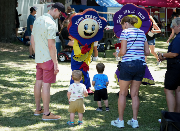 Fairfield and Rosetta, the Iowa State Fair mascots, greet children at the Fair.