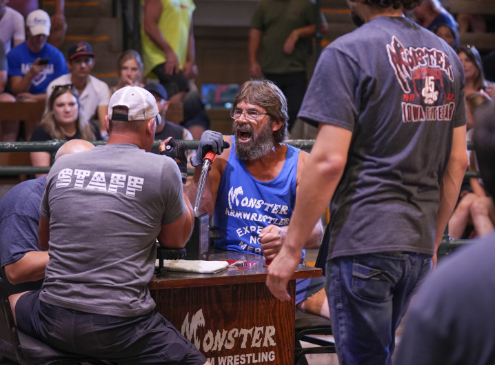 Intense participants at the monster arm wrestling contest