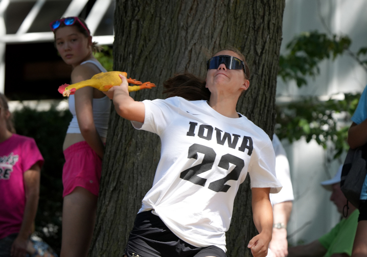 rubber chicken throwing participant mid throw