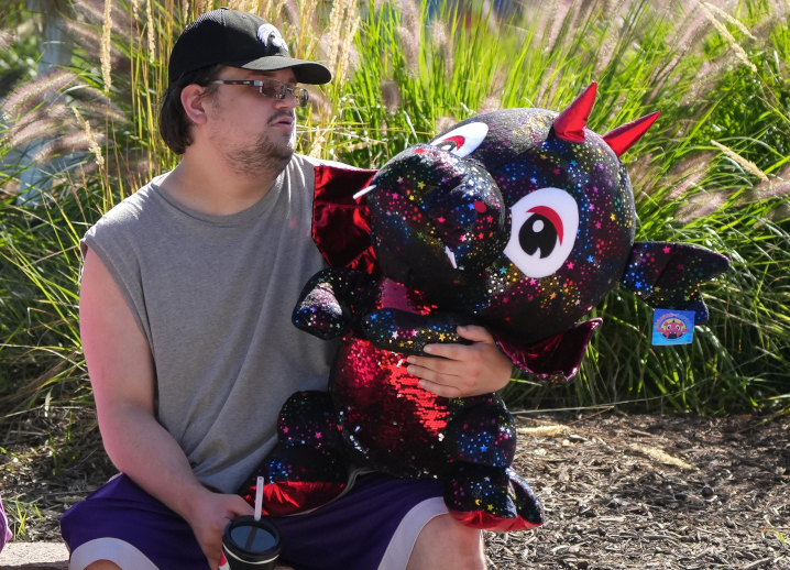 man holding stuffed animal