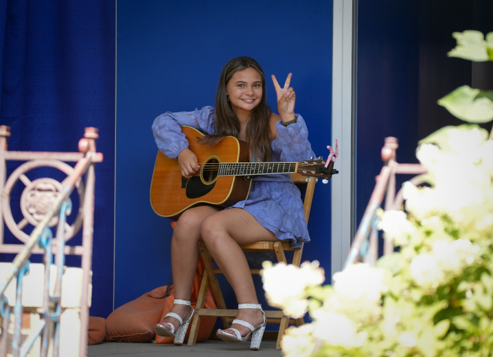 A contestant in the Bill Riley Talent Show pauses backstage to pose for a picture prior to taking the stage during the Iowa State Fair.