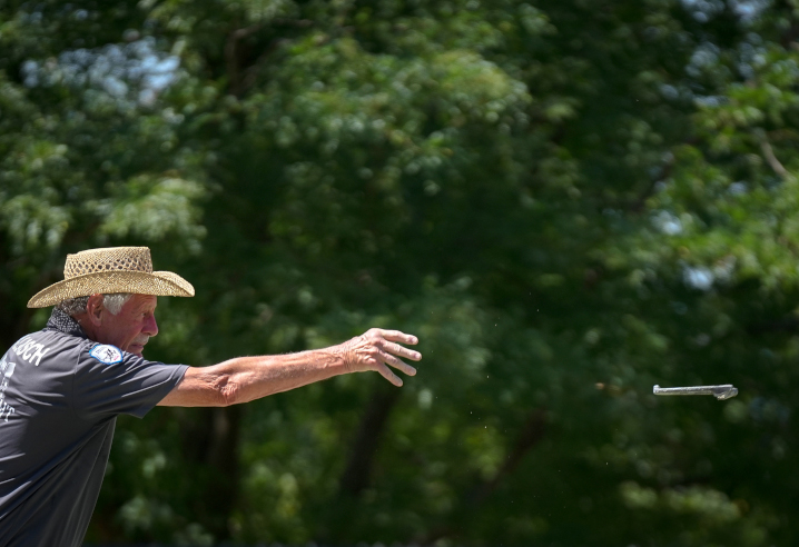 Vern Kollasch of Iowa City tosses a horseshoe in the championship horseshoe pitching contest during the Iowa State Fair