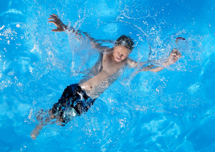 Coyce McNaul, 10, of Montezuma, cools off in a pool at the Iowa State Fair as temperatures soar above 90 degrees on Saturday, Aug. 19, 2023, at the Iowa State Fair.