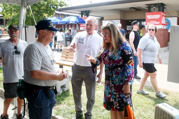 Iowa Department of Education director McKenzie Snow stopped by the STEM tent and learned from Iowa Navy veterans about the mechanics of submarines at the Iowa State Fair