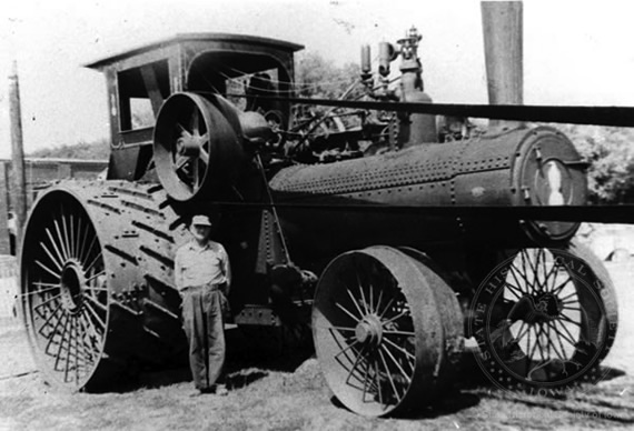 Farmer Beside Steam Tractor, ca. 1930 