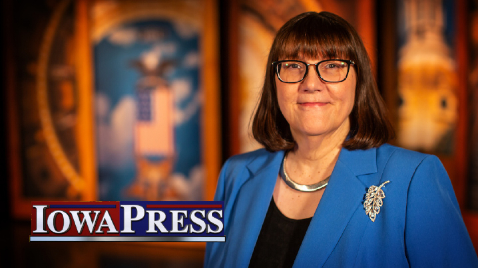 Iowa Press host Kay Henderson standing on the program's set