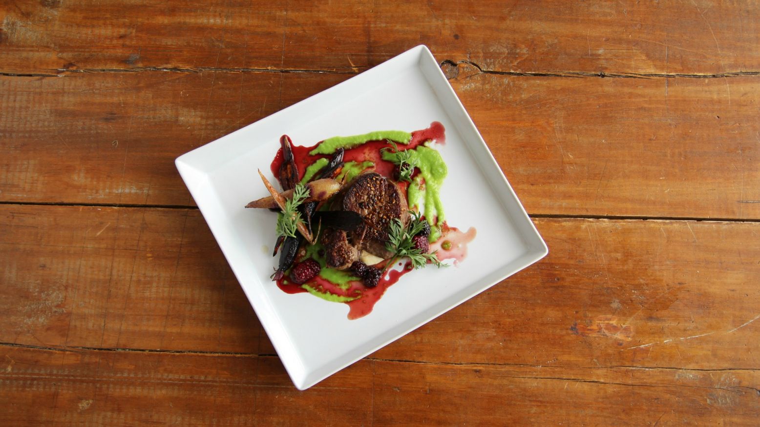 Gilled Bison Filet with English Pea Puree and Blackberry Sauce