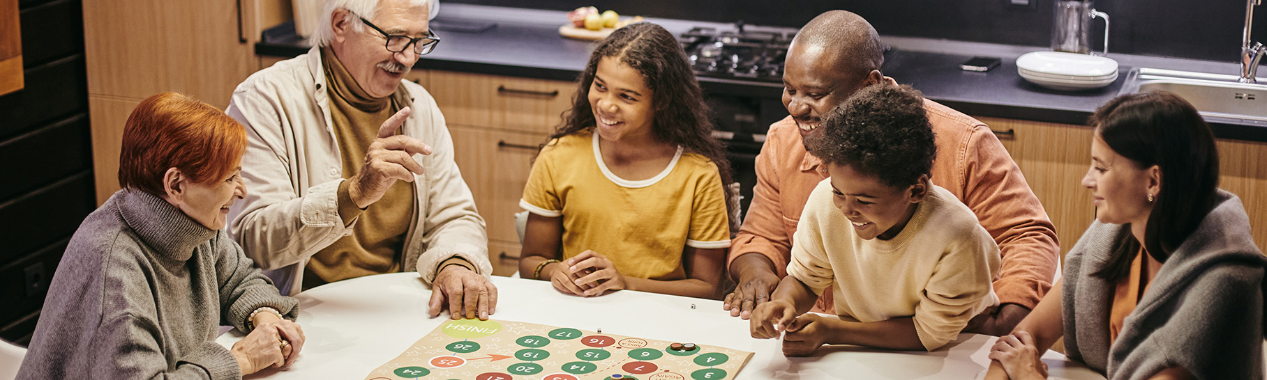 a family around a table playing a game