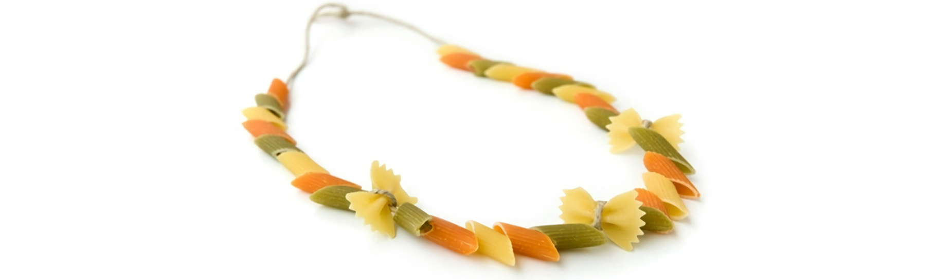 A necklace made out of pasta and stringed in an A B C pattern.