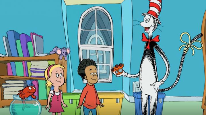 The Cat in the Hat shows a toy car to Sally, Nick and Fish.