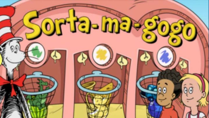 Three nets hold objects, in the first net are all green objects, the second all yellow objects and the third all blue objects.