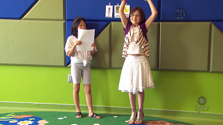 two little girls acting out their story. 