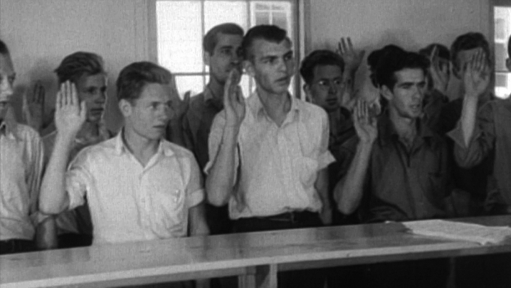young men taking the oath of service during World War II