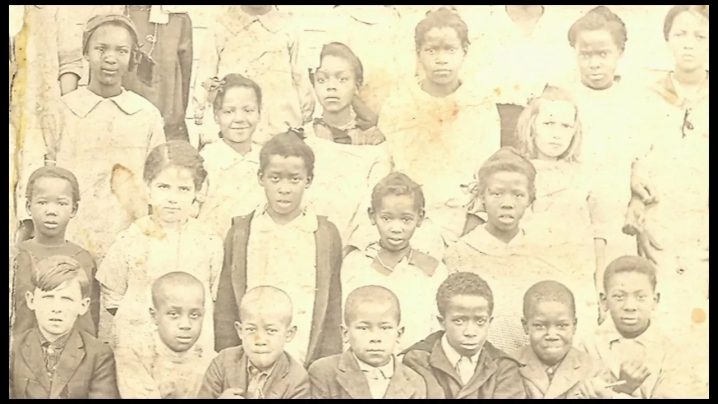 a group of racially diverse children who lived in Buxton in the early 1900s