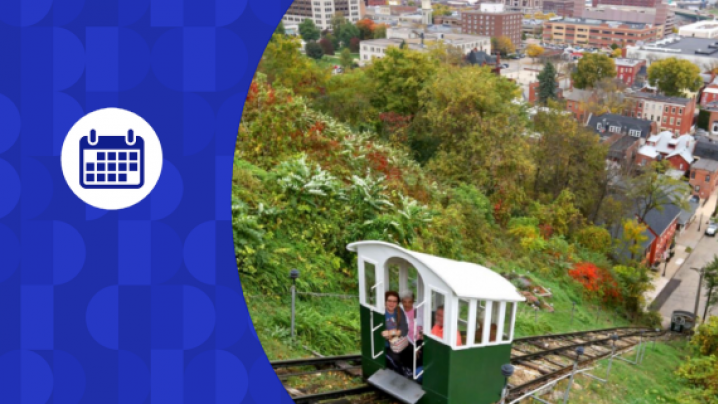 Blue calendar graphic on top of an image of houses and treetops with a train elevator