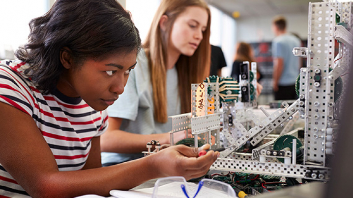 young girl working in a science lab