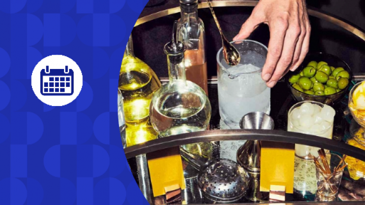 Blue calendar graphic on top of an image of drink mixer items on a bar cart