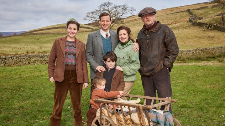 6 people from the program All Creatures Great and Small standing outdoors