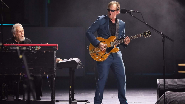 Joe Bonamassa playing guitar by piano