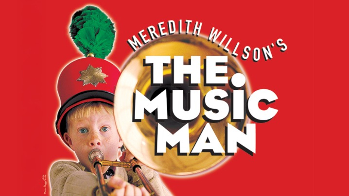 A young boy playing an instrument with the text The Music Man